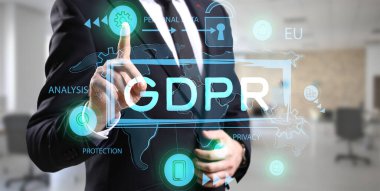 Businessman with hologram projection of data protection service in office, closeup