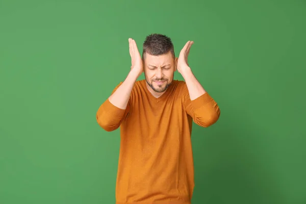 Stressed man on color background. Concept of choice — Stock Photo, Image