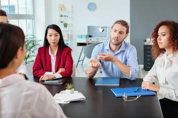 Human resources commission interviewing woman in office