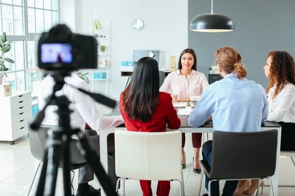 Filming of job interview with applicant in office