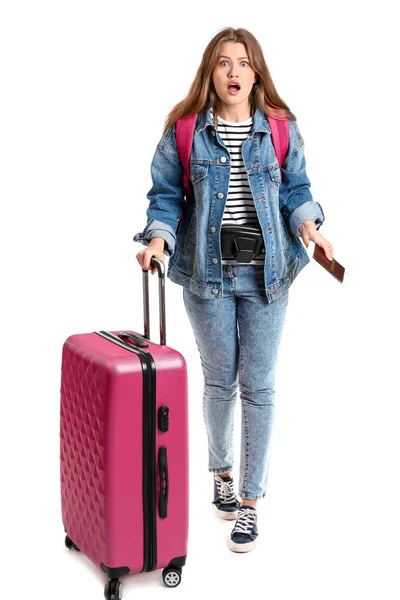 Shocked female tourist with luggage on white background — Stock Photo, Image