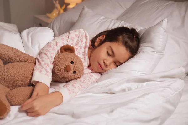 Cute little Asian girl sleeping in bed — Stock Photo, Image