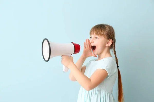 Cute little girl with megaphone on color background — Stock Photo, Image
