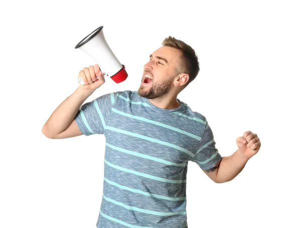 Emotional young man with megaphone on white background — Stock Photo, Image
