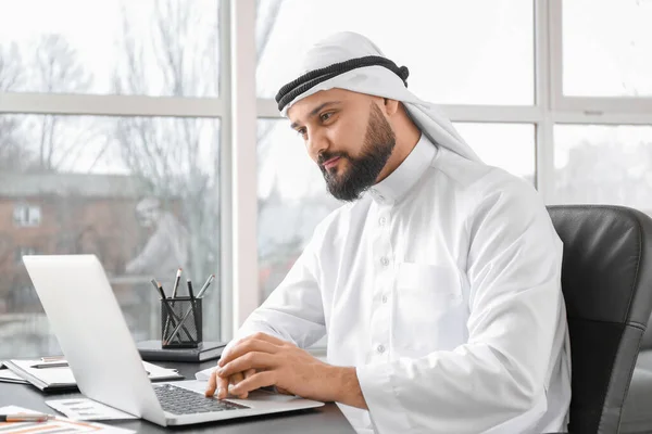 Arab businessman working in office