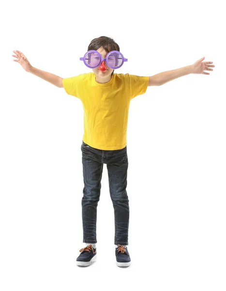 Little boy in funny disguise on white background. April fools' day celebration — Stock Photo, Image