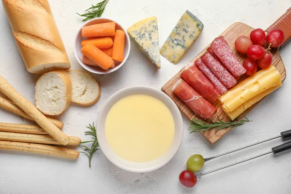 Cheese fondue with snacks on white background — Stock Photo, Image