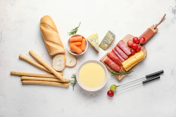 Cheese fondue with snacks on white background — Stock Photo, Image