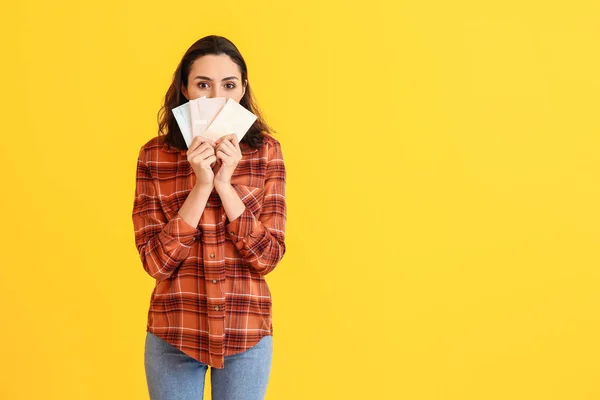 Young woman with menstrual pads on color background — Stock Photo, Image