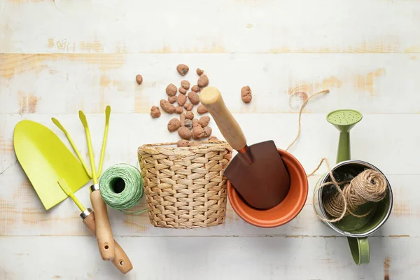 Set of gardening supplies on white wooden background — Stock Photo, Image