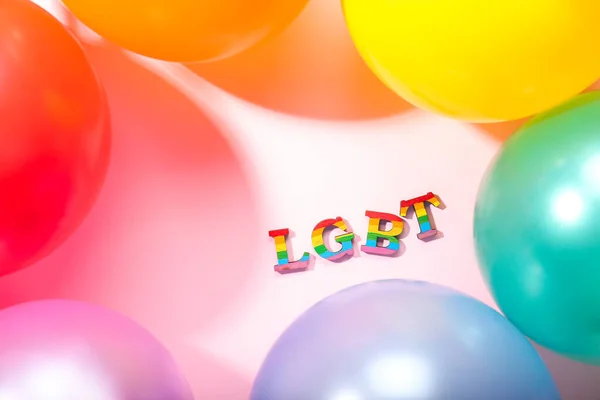 Letters LGBT with air balloons on light background — Stock Photo, Image