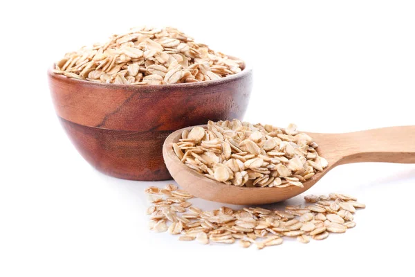 Cuenco y cuchara con avena cruda sobre fondo blanco — Foto de Stock