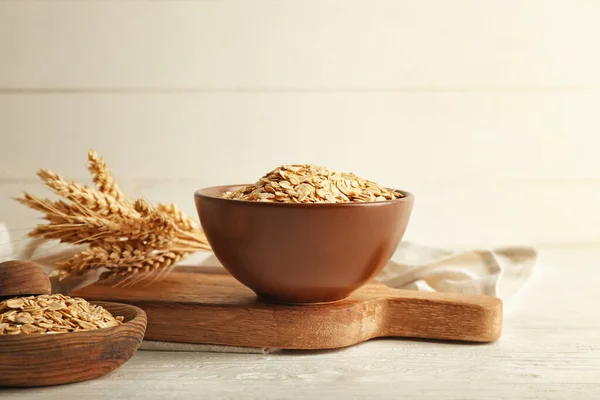 Composition with raw oatmeal on table — Stock Photo, Image