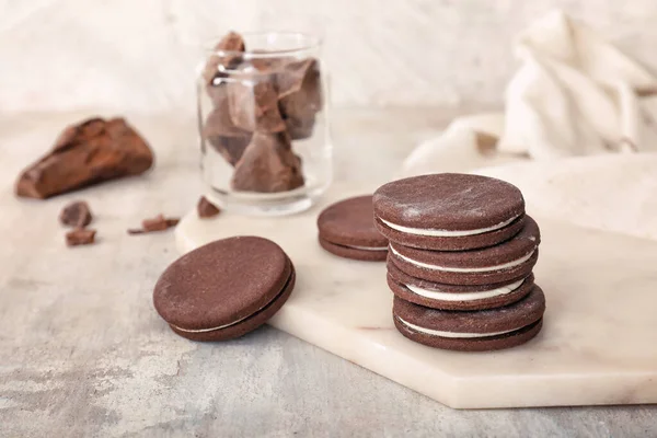 Tasty chocolate cookies on grey table — Stock Photo, Image