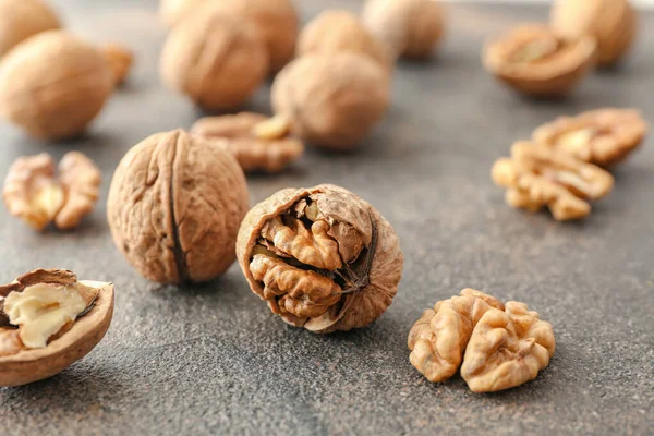 Tasty walnuts on grey table — Stock Photo, Image