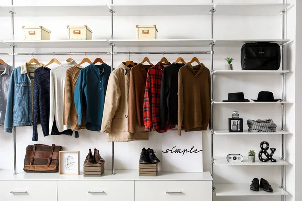 Modern wardrobe with stylish winter clothes and accessories — Stok fotoğraf