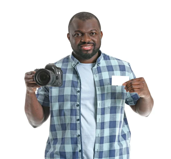 African-American photographer with camera and business card on white background — Stock Photo, Image