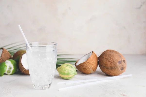 Glass of fresh coconut water on table — Stock Photo, Image