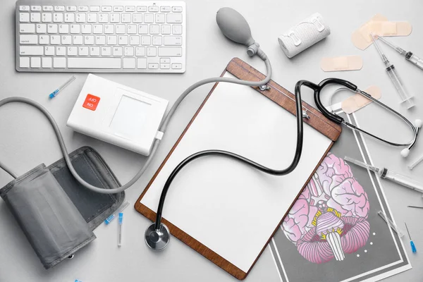Set of medical supplies with computer keyboard on light background — Stock Photo, Image