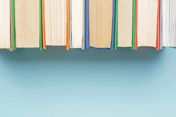 Many books on color background — Stock Photo, Image