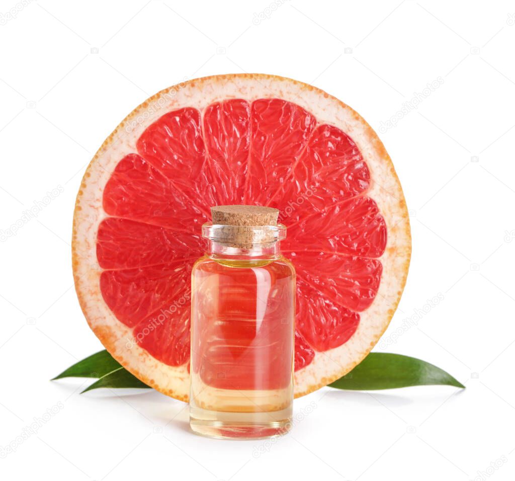 Bottle of grapefruit essential oil on white background