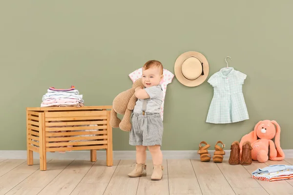 Cute baby with stylish clothes and toys at home — Stock Photo, Image