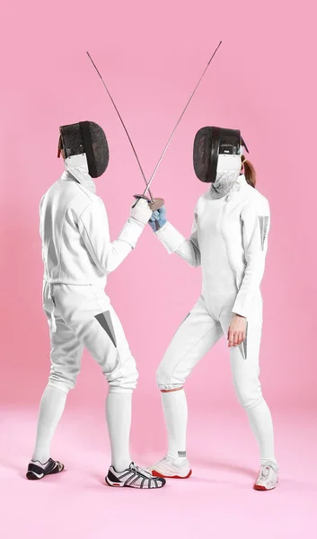 Young fencers on color background — Stock Photo, Image