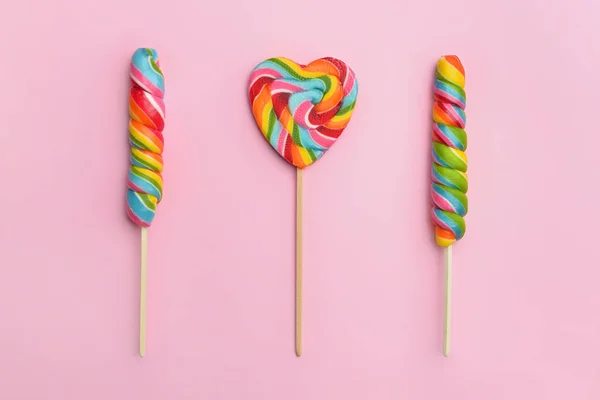 Tasty lollipops on color background — Stock Photo, Image