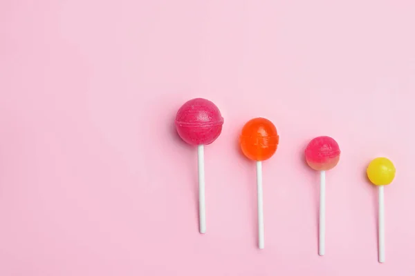 Tasty lollipops on color background — Stock Photo, Image