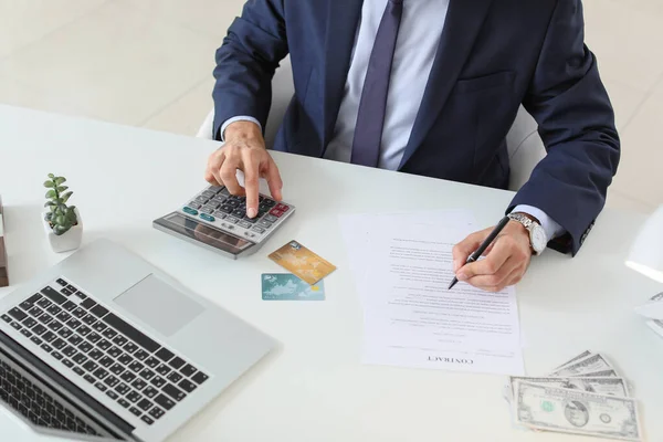 Male bank manager working in office