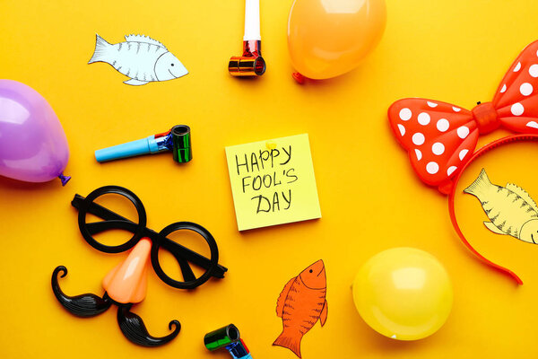 Party decor on color background. April Fool's Day prank Stock Picture