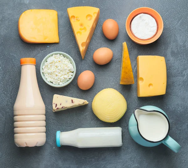 Different dairy products on grey background — Stock Photo, Image