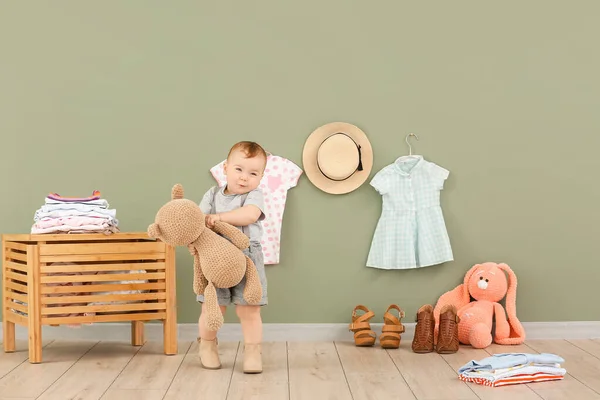 Cute baby with stylish clothes and toys at home — Stock Photo, Image