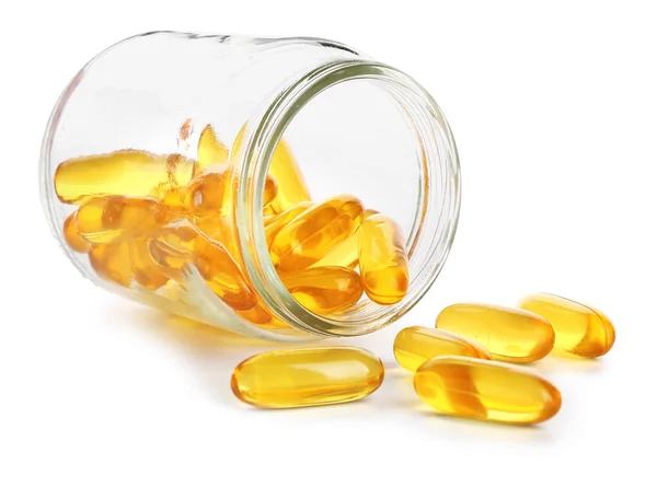 Jar with scattered fish oil pills on white background — Stock Photo, Image