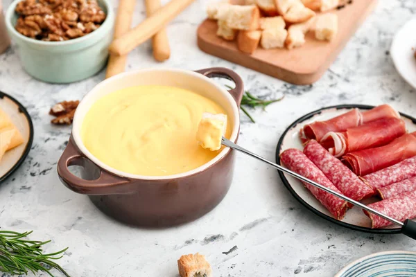 Cheese fondue with snacks on white background — Stock Photo, Image