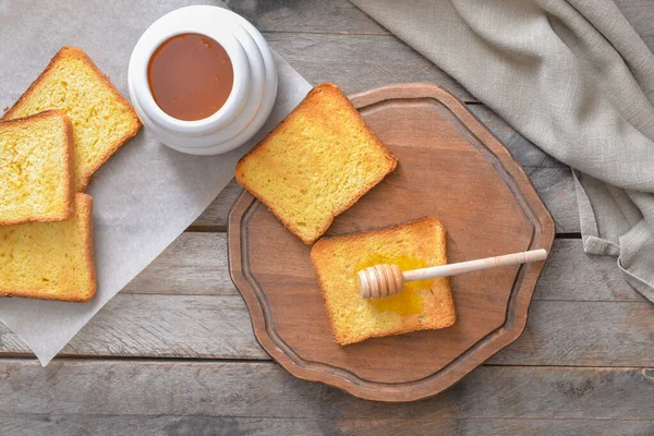 Sweet honey and toasted bread on table — Stock Photo, Image