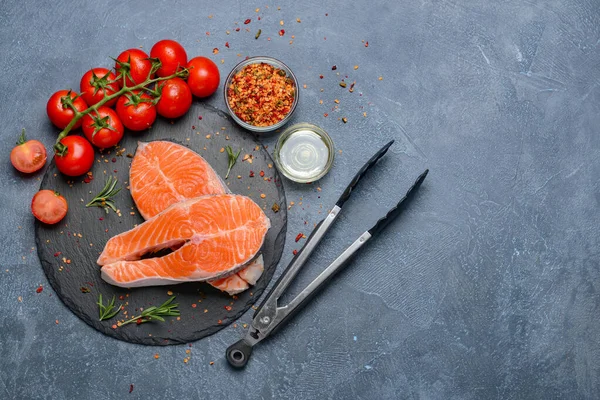 Composition with raw salmon steaks on table — Stock Photo, Image