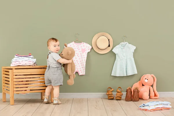 Cute baby with stylish clothes and toys at home — Stock Photo, Image