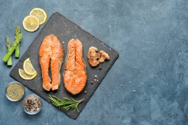 Composition with fried salmon on table
