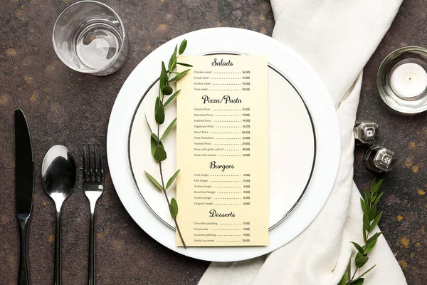 Beautiful table setting with menu on grey background — Stock Photo, Image