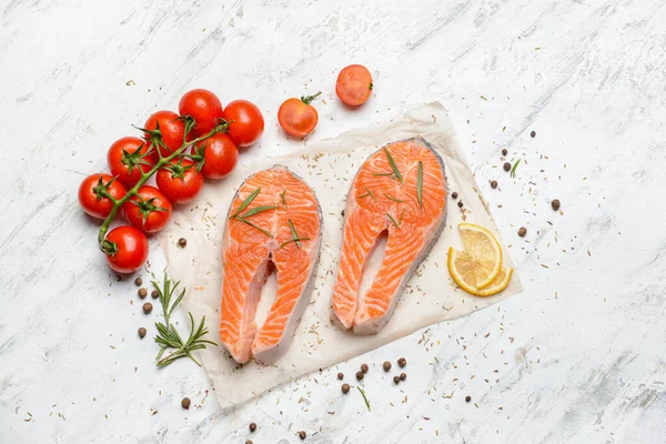 Composition with raw salmon steaks on table — Stock Photo, Image