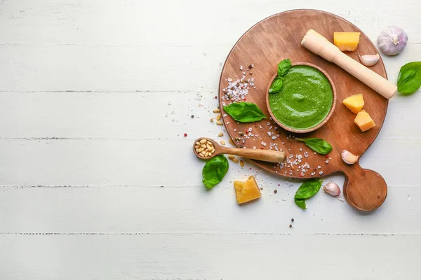 Pesto sauce with ingredients on white wooden background — Stock Photo, Image