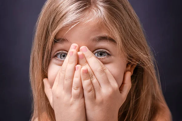 Cute little girl on dark background — Stock Photo, Image