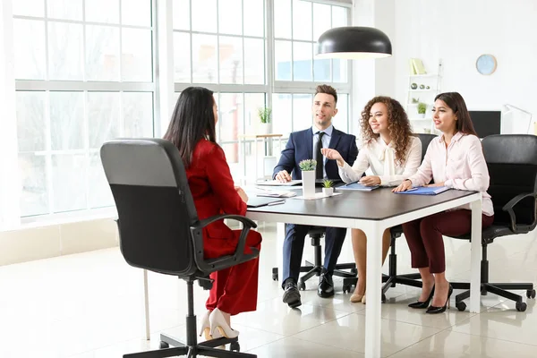 Human resources commission interviewing woman in office