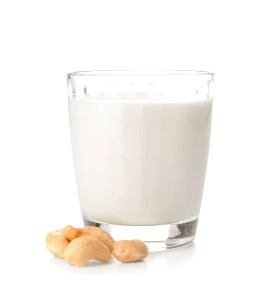 Glass of fresh cashew milk on white background — 스톡 사진