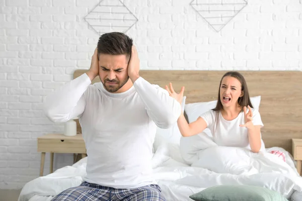 Young couple quarreling in bedroom — ストック写真