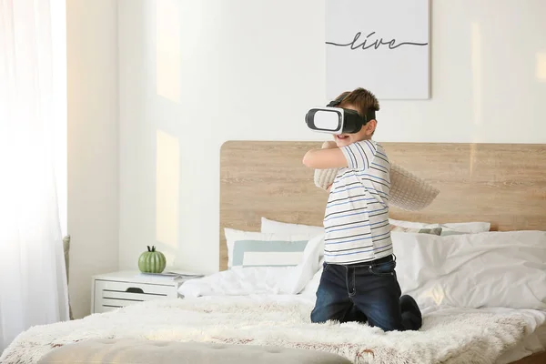 Little boy with virtual reality glasses in bedroom — Stock Photo, Image