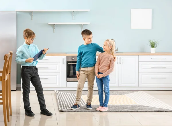 Little real estate agent working with clients indoors — Stock Photo, Image