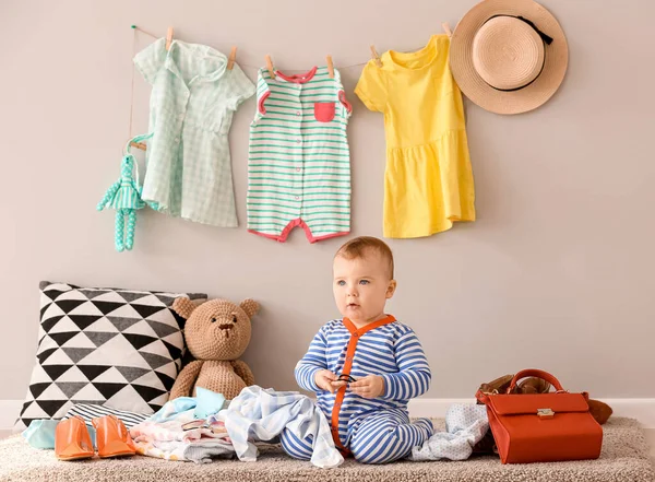 Cute baby with stylish clothes and accessories at home — Stock Photo, Image