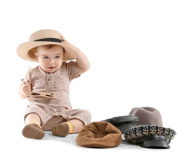 Cute baby with stylish hats on white background — Stock Photo, Image